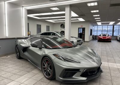 Silver sports car display in a building